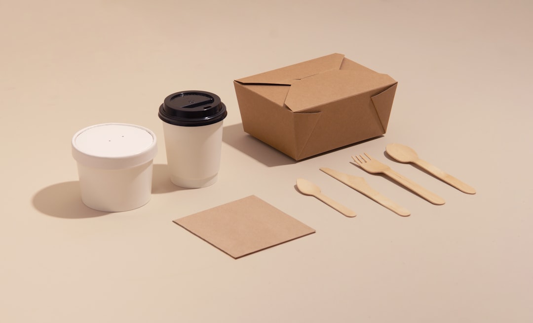 Compostable paper cup and food box, examples of mixed-material packaging